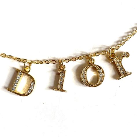 dior gold letter necklace|dior spellout necklace.